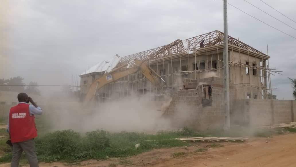 An illegal structure being demolished in Asaba by the Delta State Taskforce on Land Recovery