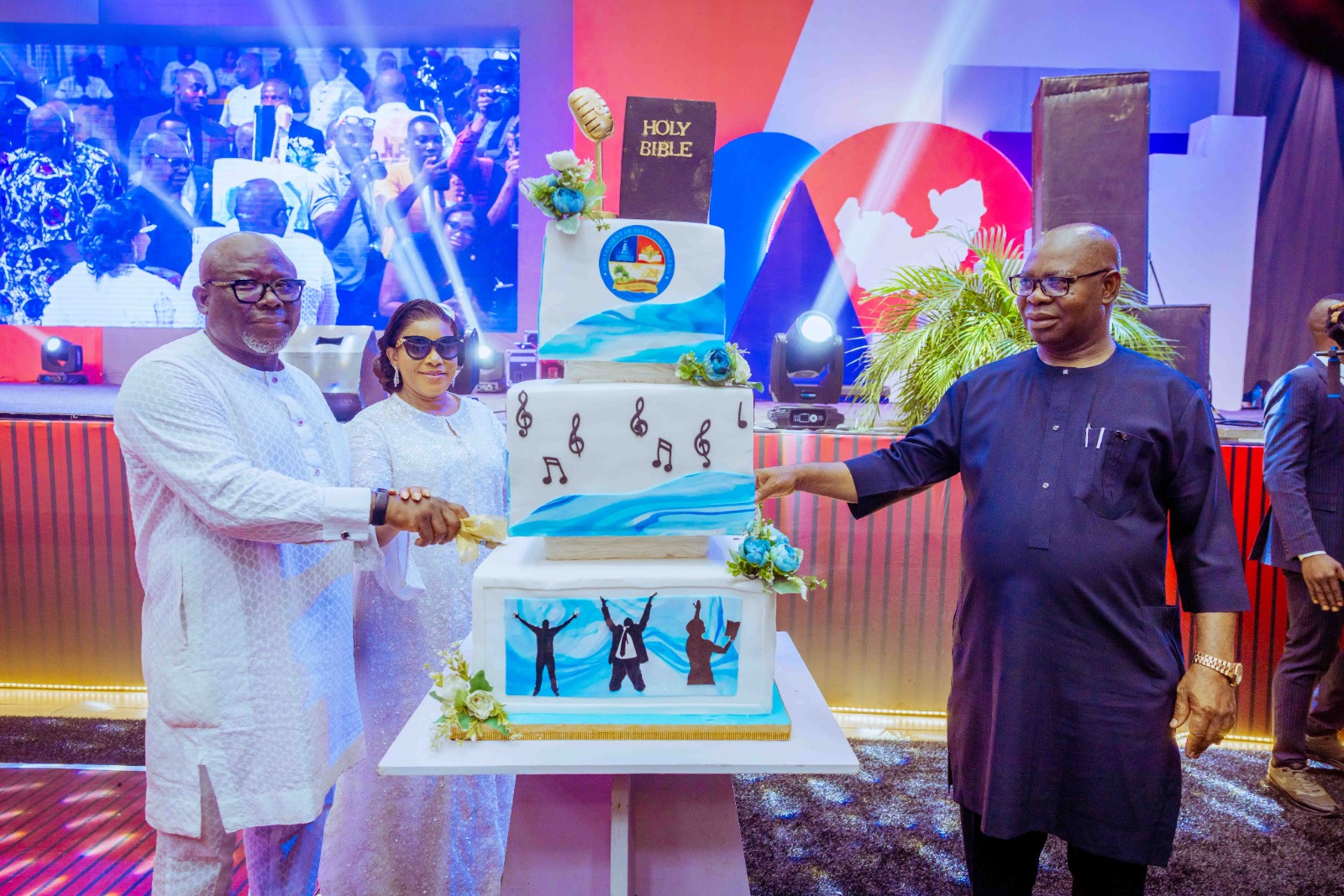 (From Left) Delta Governor, Rt. Hon. Sheriff Oborevwori, Wife, Deaconess Tobore Oborevwori and Deputy Governor, Sir Monday Onyeme cut the First Year Anniversary cake at the Delta Praise and Worship Day on Wednesday, May 29, 2024