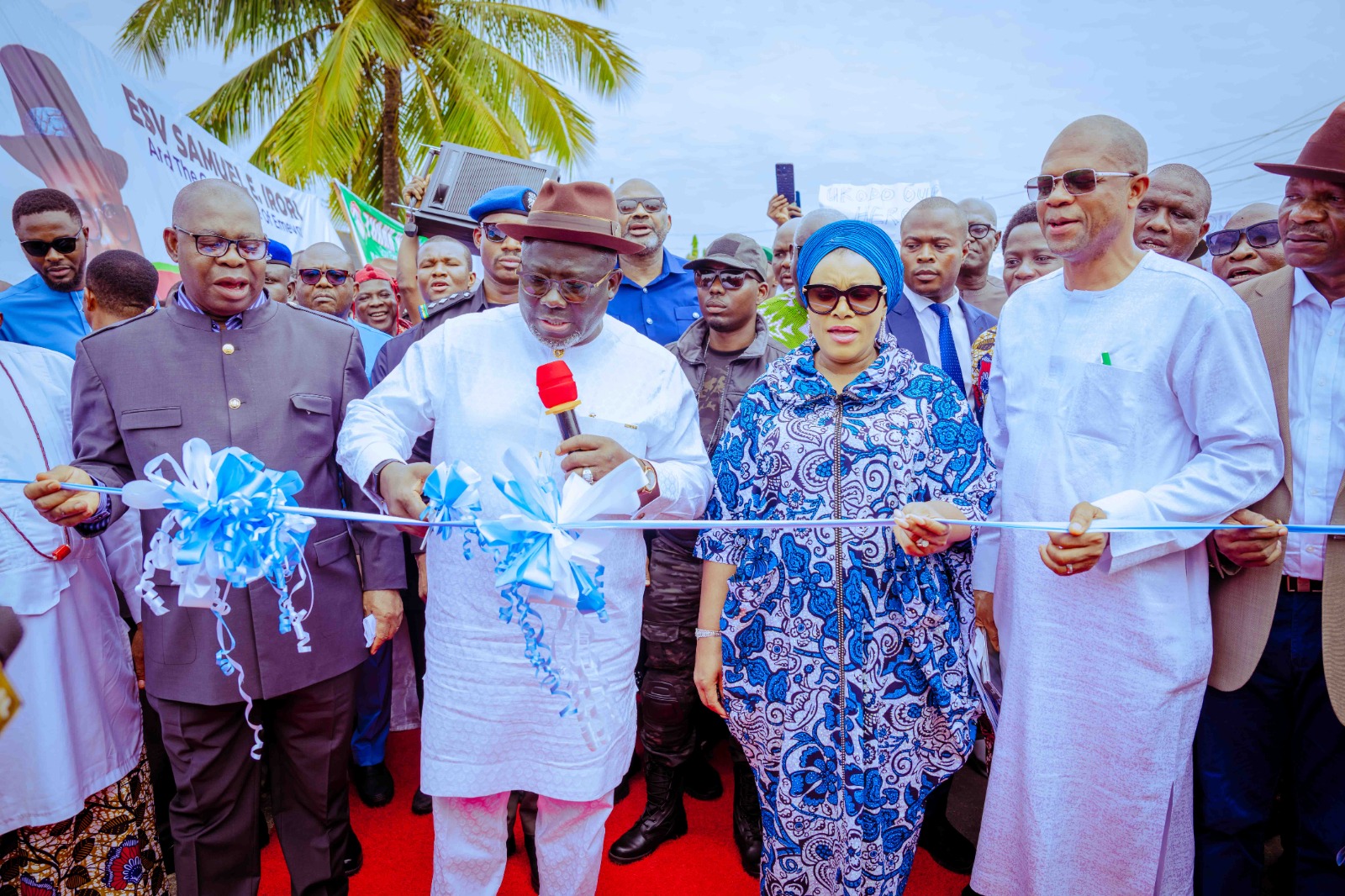 Delta Governor, Rt. Hon. Sheriff Oborevwori (2nd left) supported by his wife, Deaconess Tobore Oborevwori (2nd right), his Deputy, Sir. Monday Onyeme (left), member Representing Isoko Federal Constituency in the Federal House of Representative, Pastor Jonathan Ukhodiko (right), as he cuts tape to inaugurate the newly constructed Emevor Orogun /Road Phase One on Tuesday, June 11, 2024
