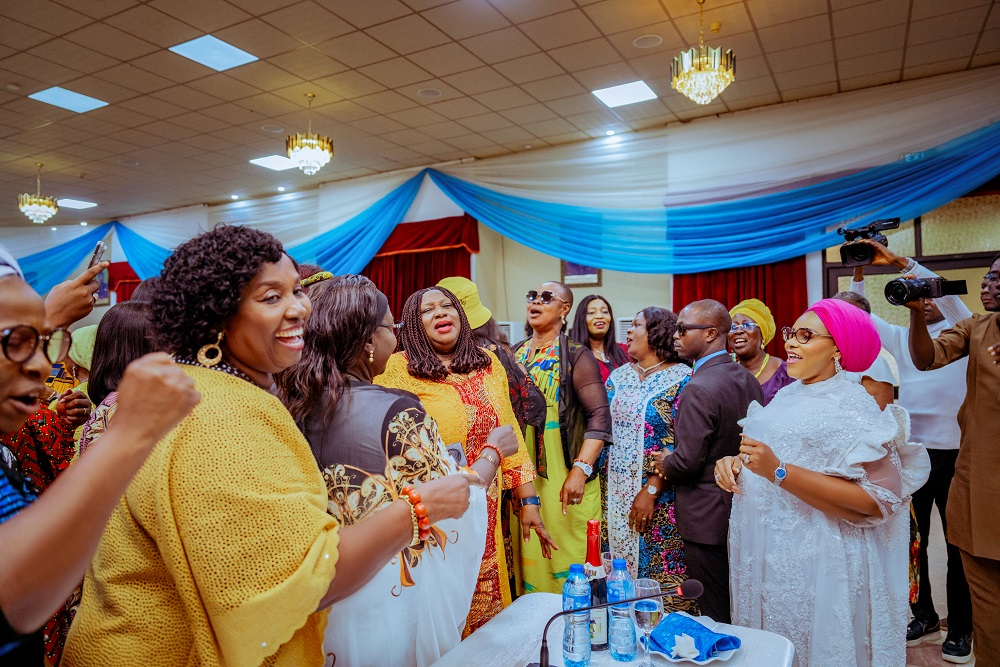 Deaconess Tobore Oborevwori (in white gown) dancing with the women at the meeting