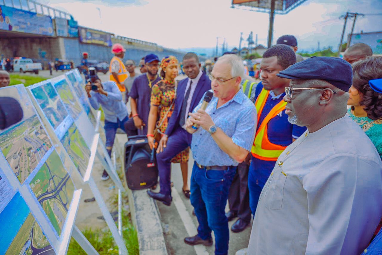 Delta Governor, Rt. Hon. Sheriff Oborevwori (right), listens as the South-South/South East Project manager, Julius Berger, Mr. Thomas Haug (3rd right), interpretes the structural drawing during his inspection of ongoing work on the Effurun roundabout/PTI junction and DSC Roundabout flyovers and road expansion projects on Sunday . With them is the Chief resident Engineer, Engr. Bob Nakpodia (2nd right) and others on Sunday, July 14, 2024.