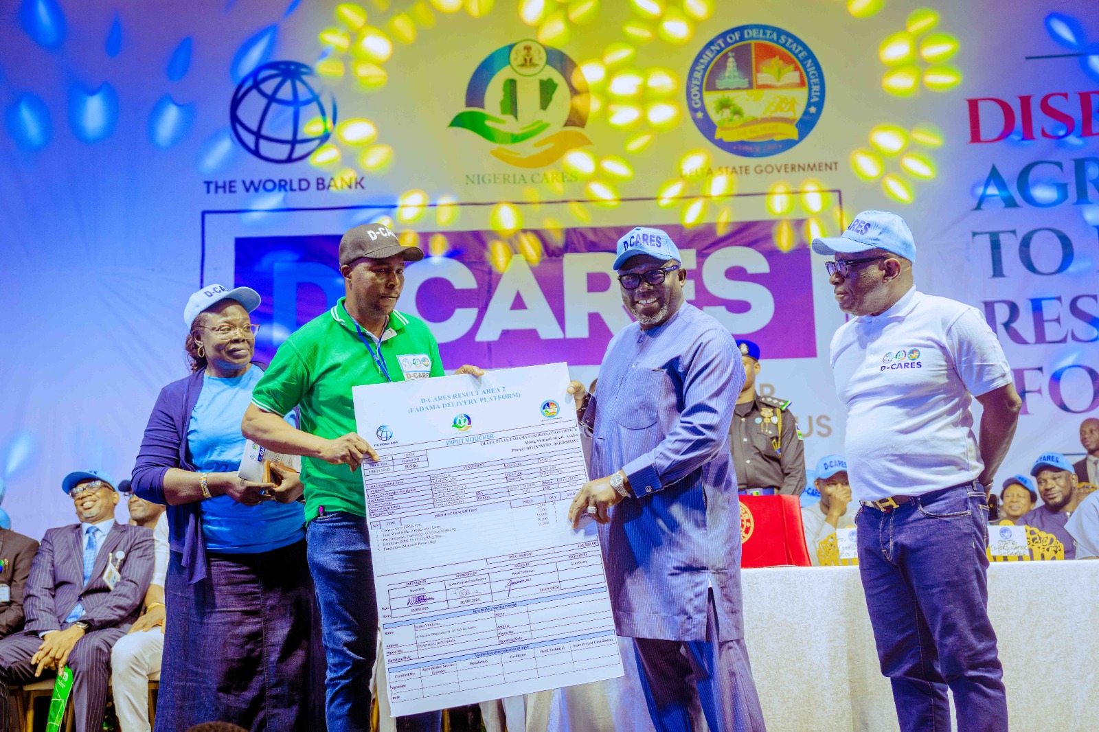 Delta State Governor, Rt. Hon. Sheriff Oborevwori (2nd right) presenting a voucher to Mr. Ossai Sunday (2nd left), while the Commissioner for Economic Planning, Mr. Sonny Ekedayen (right) looks on during the disbursement of Agricultural inputs to beneficiaries Under Result Area 2 FADAMA (Food Security) on Tuesday, September 24, 2024.