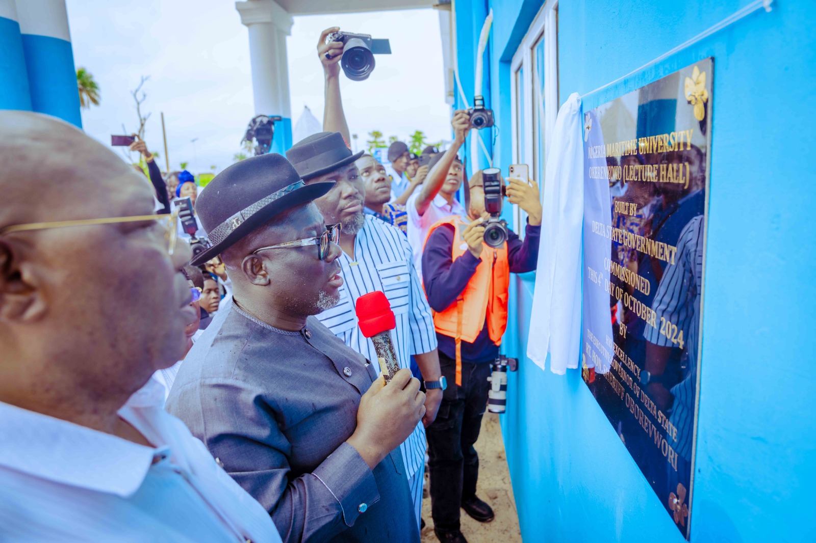 Delta State Governor, Rt. Hon. Sheriff Oborevwori (middle), immediate past Deputy Governor of Delta State, Barr. Kingsley Otuaro (left) and Hon. Julius Pondi (right) unveiling plague during the inauguration of a lecture hall in the Nigerian Maritime University, Okerenkoko on Friday, October 4, 2024