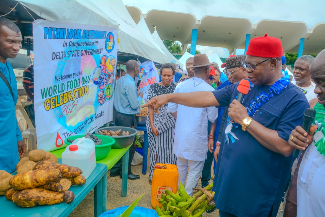 Deputy Governor of Delta State, Sir Monday Onyeme, points at something of interest during the World Food Day celebration in Asaba