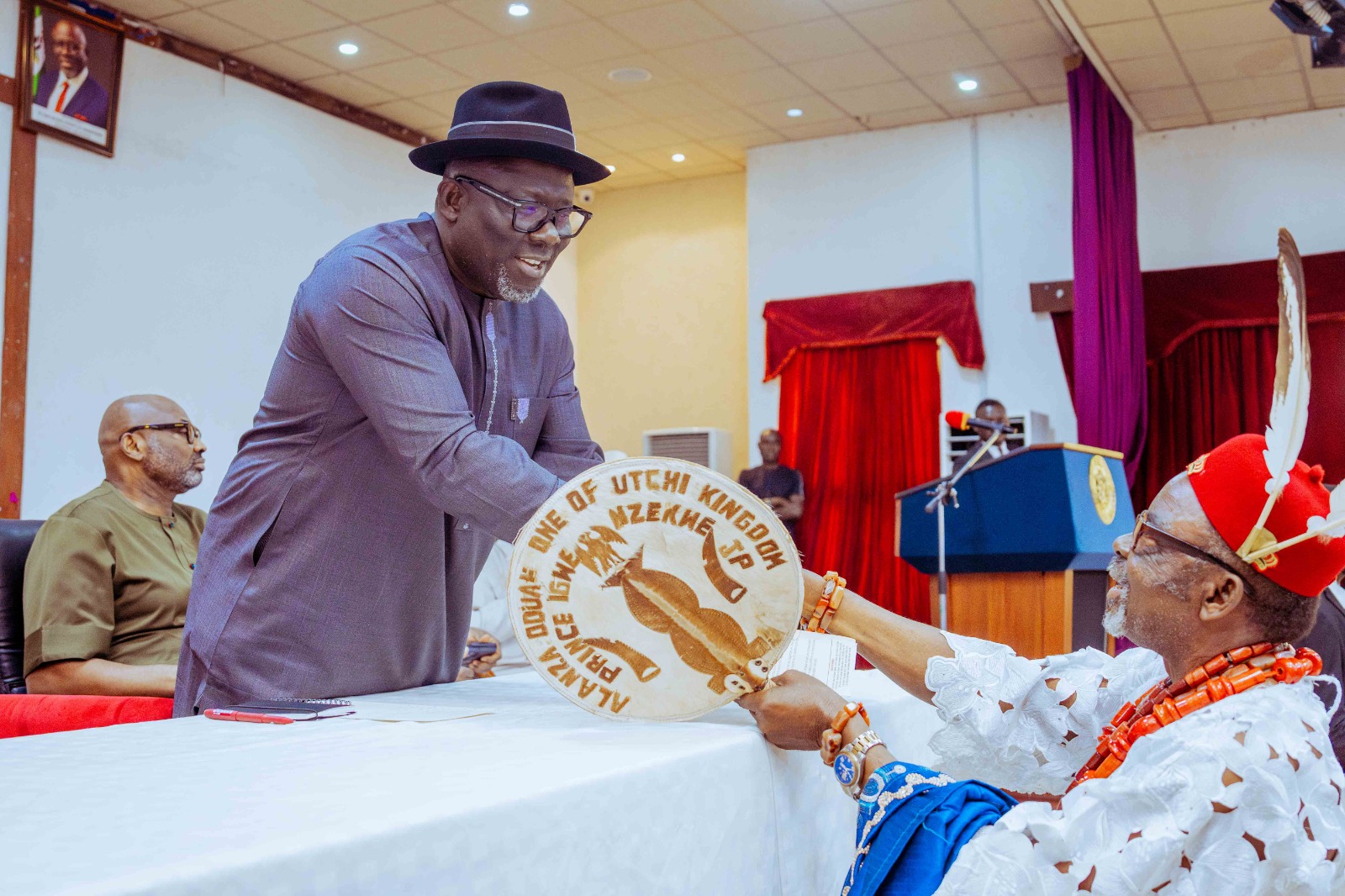 Delta State Governor, Rt Hon Sheriff Oborevwori (left), being presented a copy of speech by the President General of the Association of Presidents-General of Communities and Kingdoms, Prince Igwe Nzekwe during a meeting between the Governor and President Generals in Asaba on Wednesday, December 18, 2024