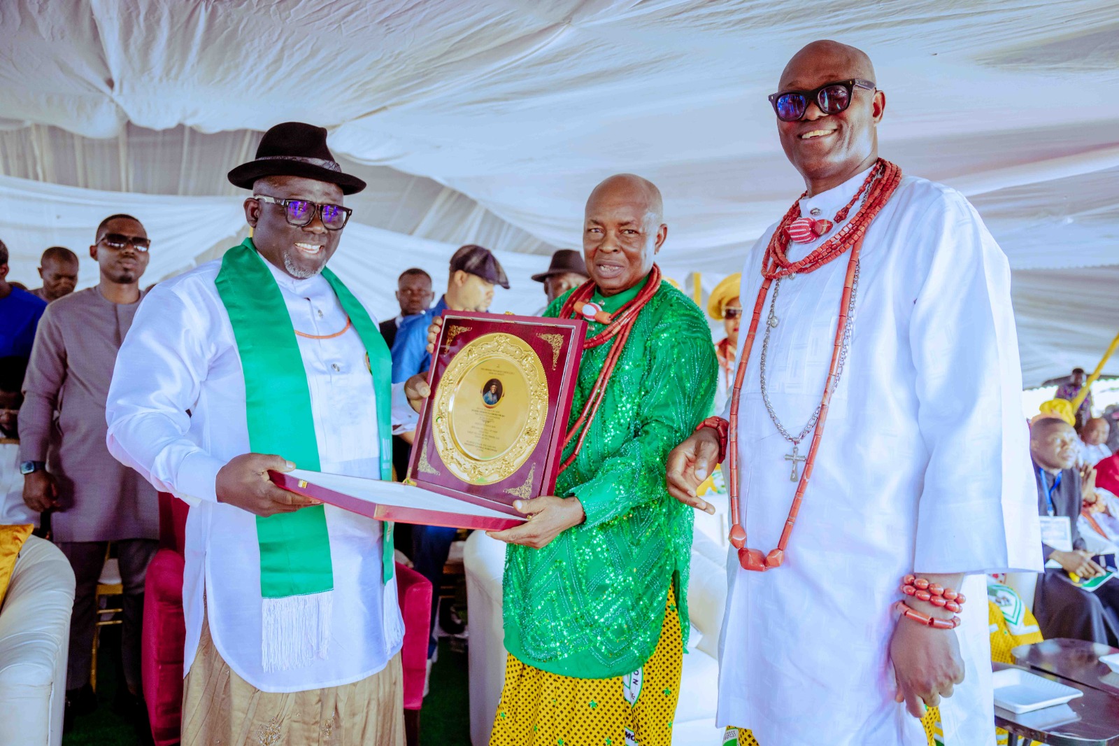 Delta State Governor, Rt. Hon. Sheriff Oborevwori being inducted into the Urhobo Progress Union Hall of Fame by the President General of UPU, Chief Ese Gam during the 93rd Urhobo National Day at Uvwiamuge, Agbarho on Saturday, December 7, 2024.