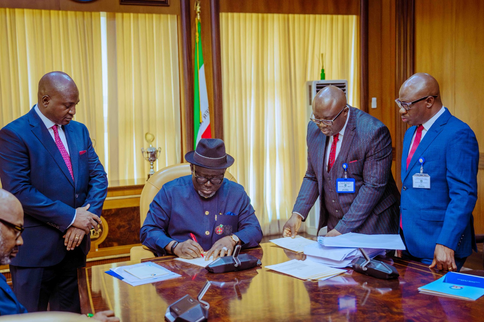 Delta Governor, Rt Hon Sheriff Oborevwori, signing the 2025 Appropriation bill into law as the Speaker of the State House of Assembly, Rt Hon Emomotimi Guwor (3rd right), the Secretary to State Government, Dr Kingsley Emu (2nd left), the Attorney-General and Commissioner for Justice, Ekemejero Ohwovoriole, SAN (2nd left) and Clerk of the House, Mr. Aghoghophia Otto, 2nd right look on at Government House on Wednesday, December 4, 2024