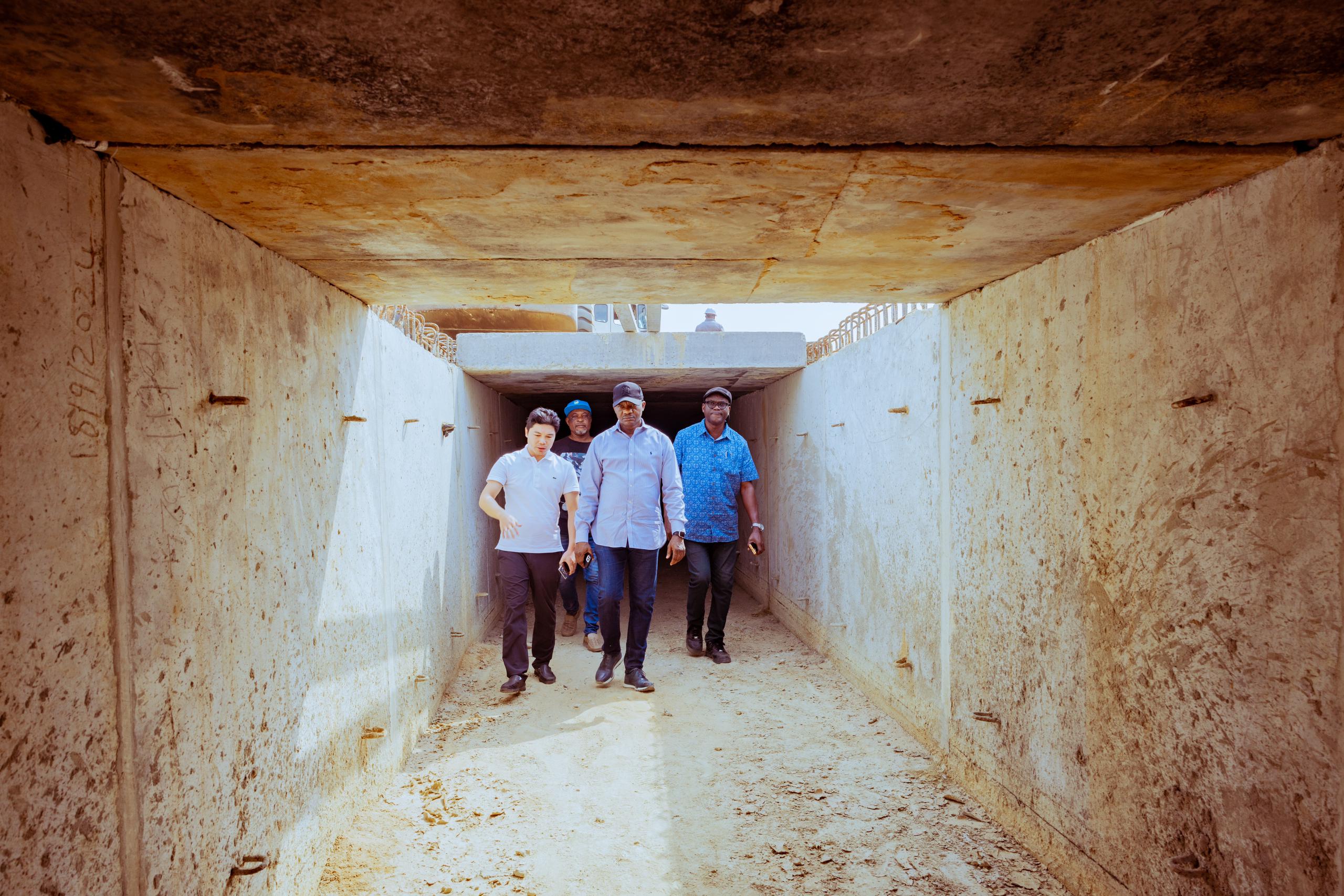 Delta State Commissioner for Works (Rural and Riverine Roads), Mr. Charles Aniagwu (2nd left), inspecting a storm drain project at Ugolo-Okpe, with him is the Director, Rural Roads, Mr Solomon Aragba (right), and the Project Manager, Mr Sunny Chen at Osubi in Okpe LGA.