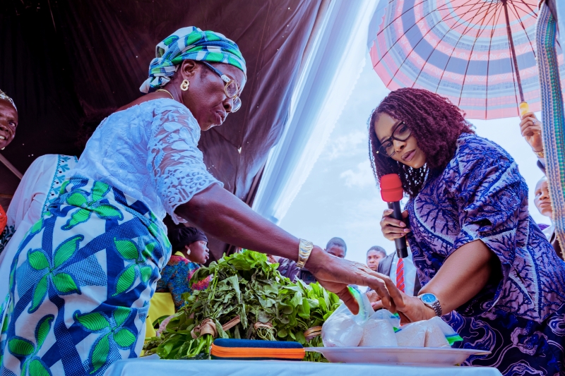 Her Excellency, Deaconess Tobore Oborevwori purchasing food items from a vendor at International Women's Day 2025 in Delta State